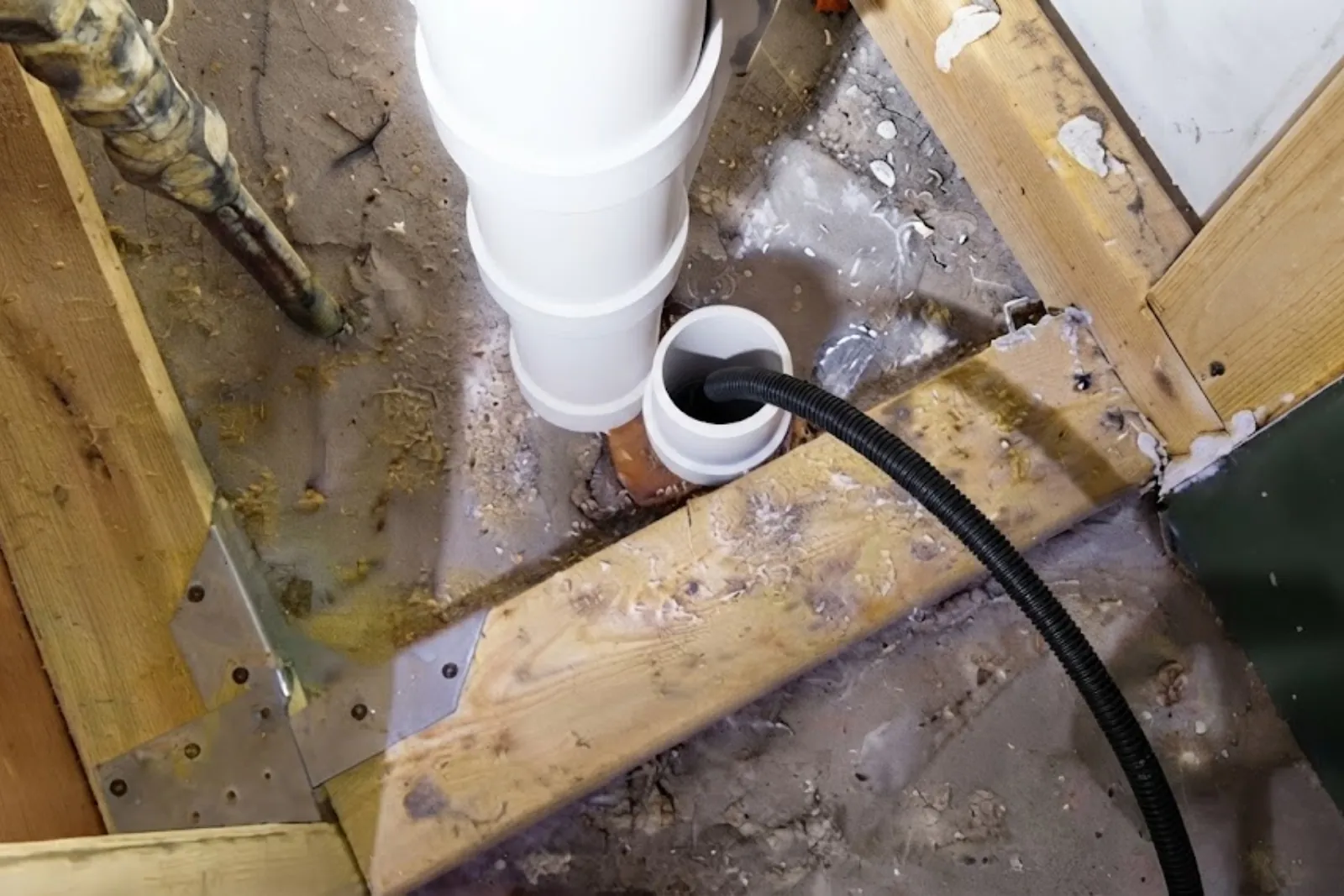 Hydro jetting hose fed into a PVC sewer cleanout
