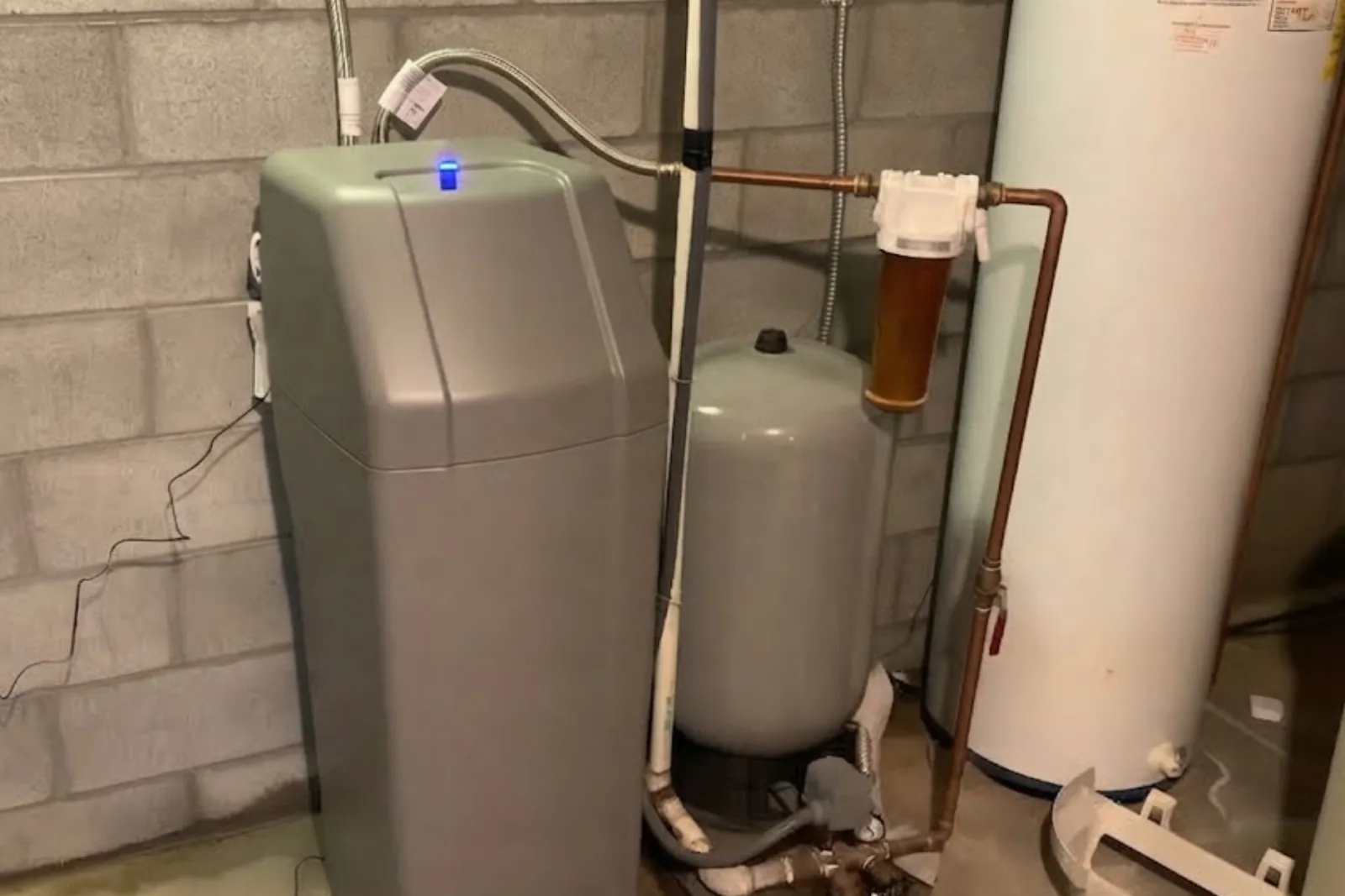 Water softener and brine tank installed in a basement